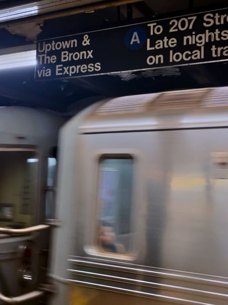 Uptown train sign in NYC Subway