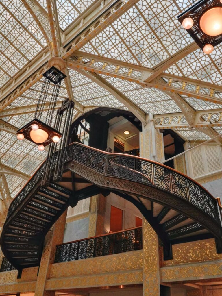 The ornate gold and marble lobby of the historic Rookery Building, a must-see during three days in Chicago.